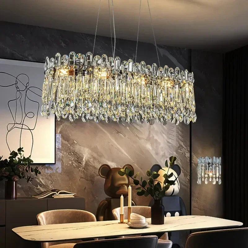 Gold oval crystal chandelier measuring 34.6 inches long in brushed steel