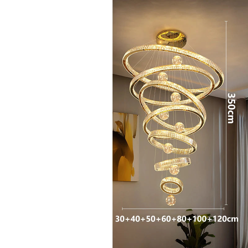 Stainless steel and crystal ring chandelier for a tall stairwell