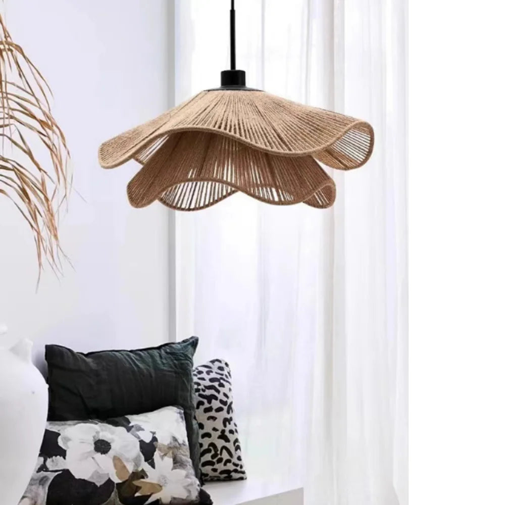 Natural hemp rope shade chandelier filtering light through its open weave