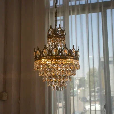 Matching crown crystal table lamp on a brushed gold iron base