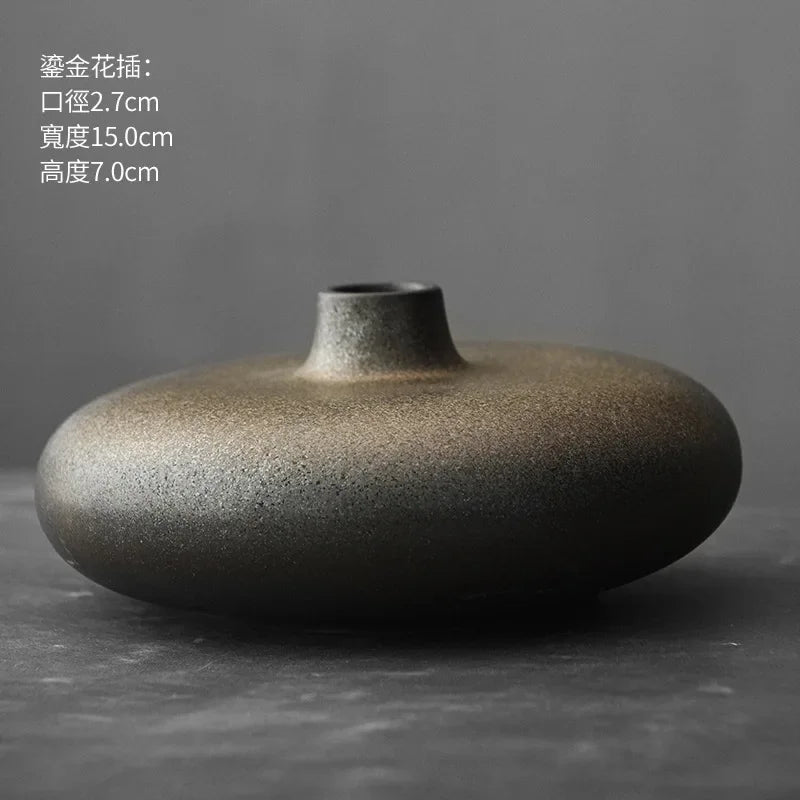 Abstract stone finish terracotta vase illuminated by natural window light