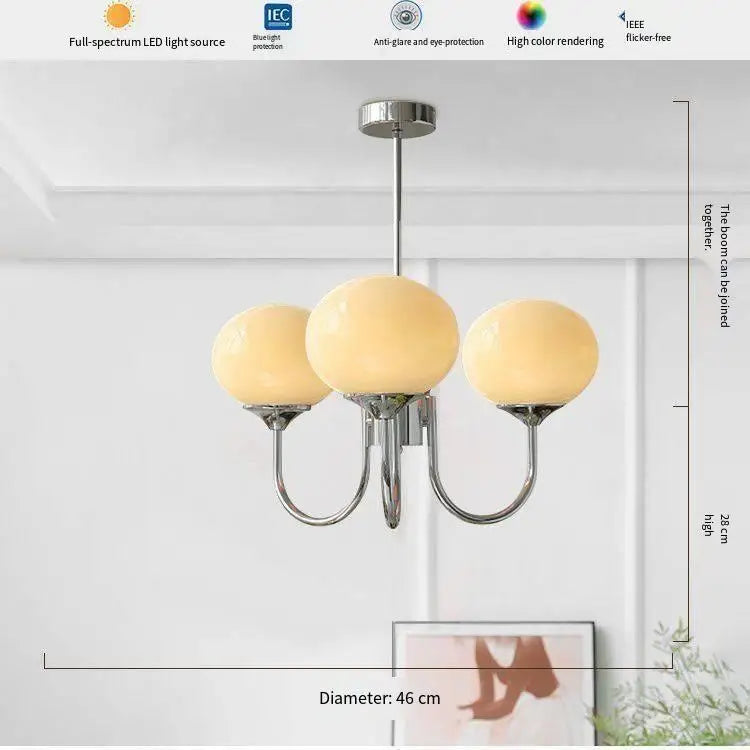 Silver finish glass ball chandelier with cream frosted globe shades