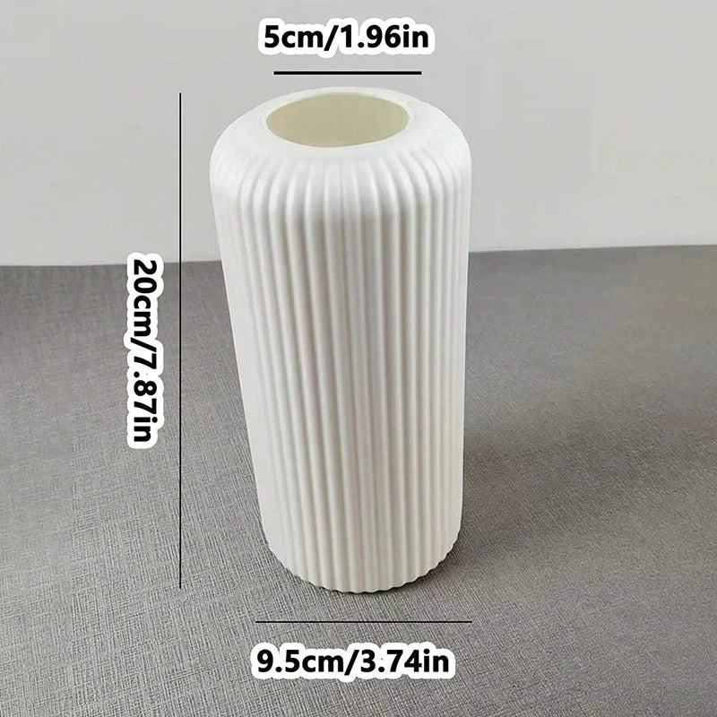 Side view of striped plastic flower vase with matte ceramic finish