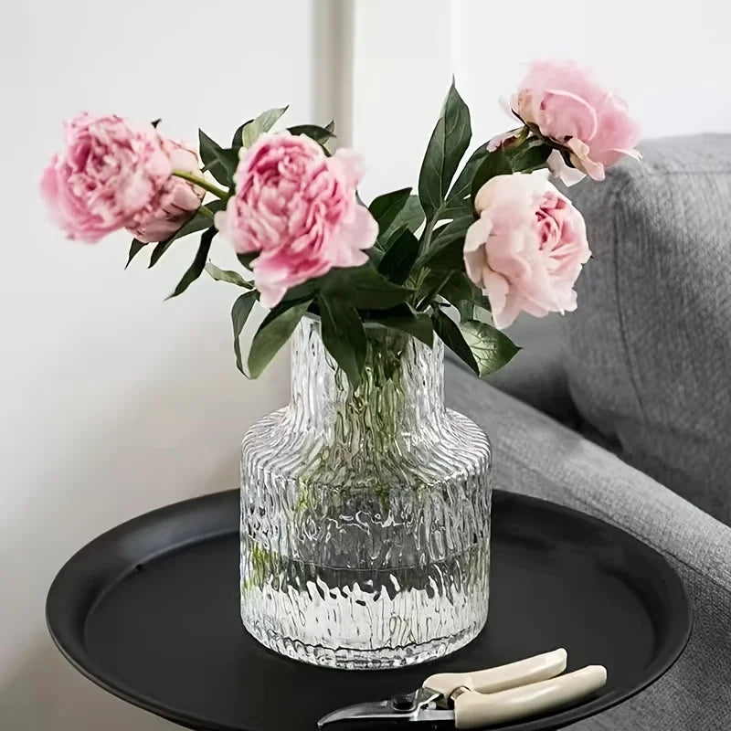 Wide mouth glacier glass vase with fresh white peonies on dining room table