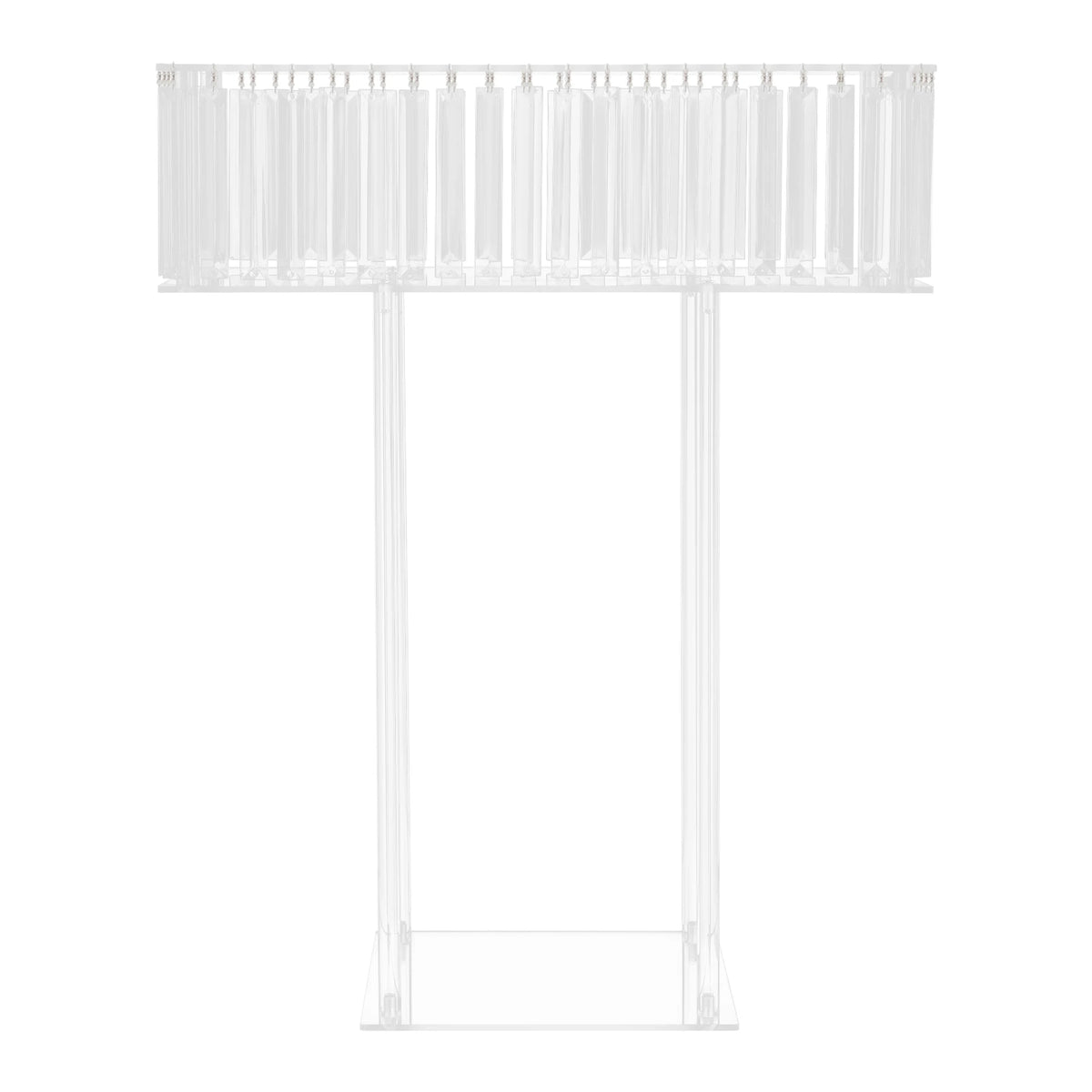 Tall crystal acrylic flower display stand holding lush floral arrangement at outdoor ceremony