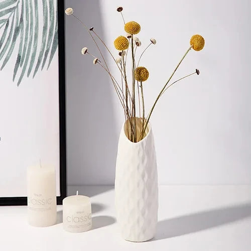 Small white plastic vase with fresh wildflowers for kitchen countertop accent