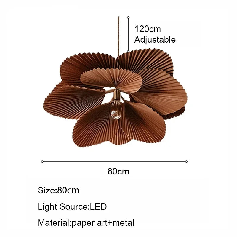 Paper fan chandelier with warm light diffusing through the shade