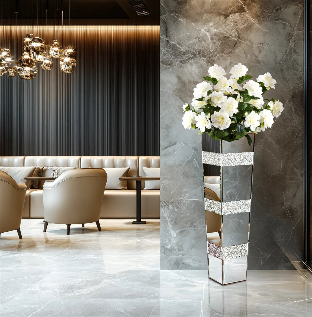 Polished mirrored crystal vase reflecting light in Hollywood Regency interior