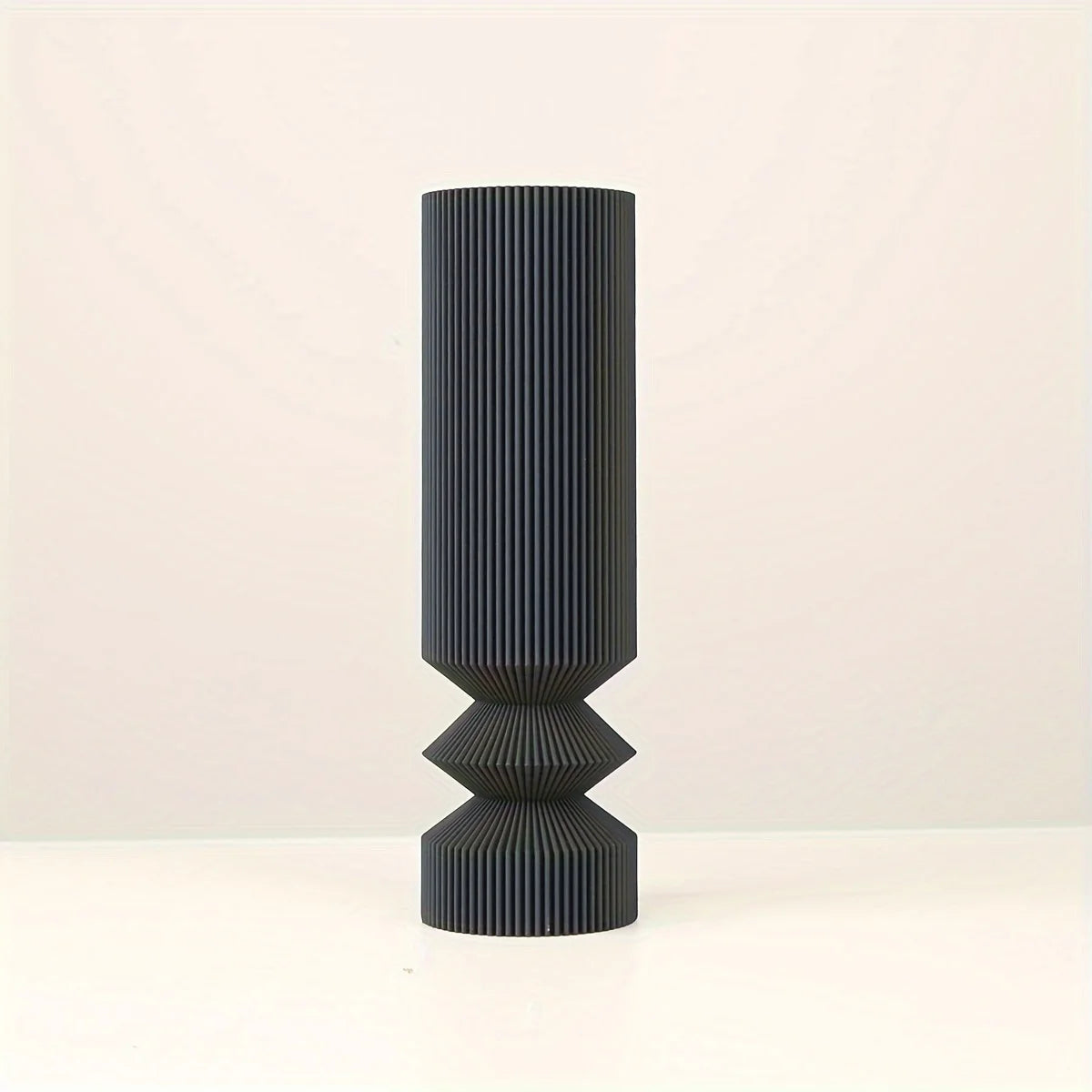 Medium Nordic black vase with single white flower on dining table