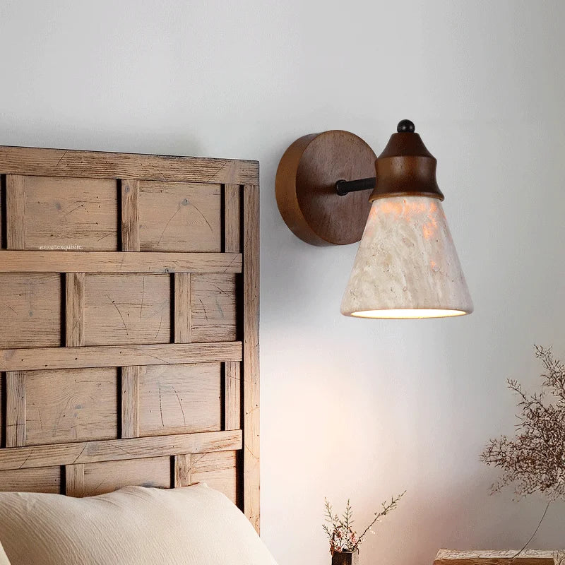 travertine stone wall sconce, installed in a room interior setting