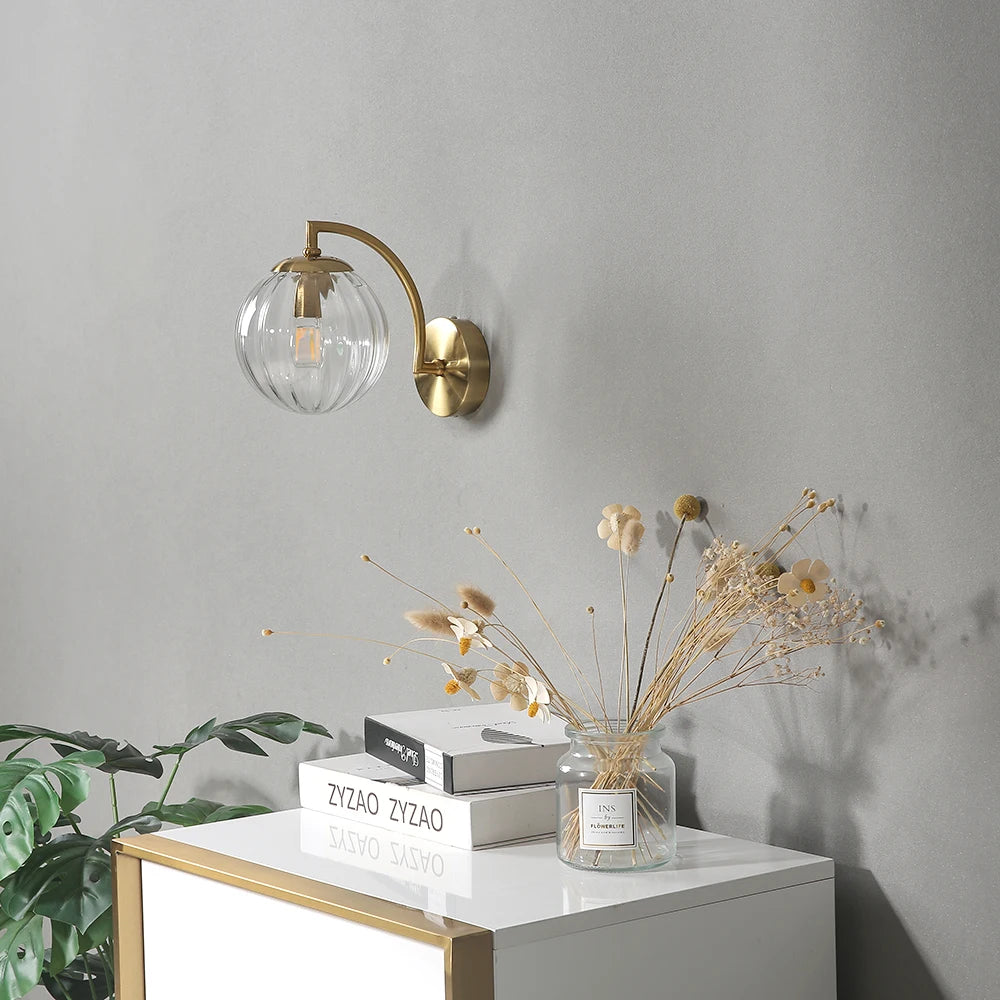 glass wall sconce, detail view of fixture base and arm