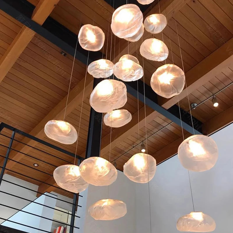 Glass drop chandelier on slim iron cords with a 78.7 in adjustable drop