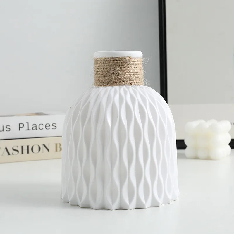 Four pineapple twine plastic vases in pink, beige, white, and grey colorways