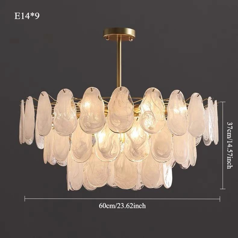 Multilayer lantern chandelier over a kitchen island in warm light