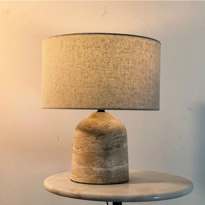 Nordic cylindrical marble table lamp on bedroom bedside table
