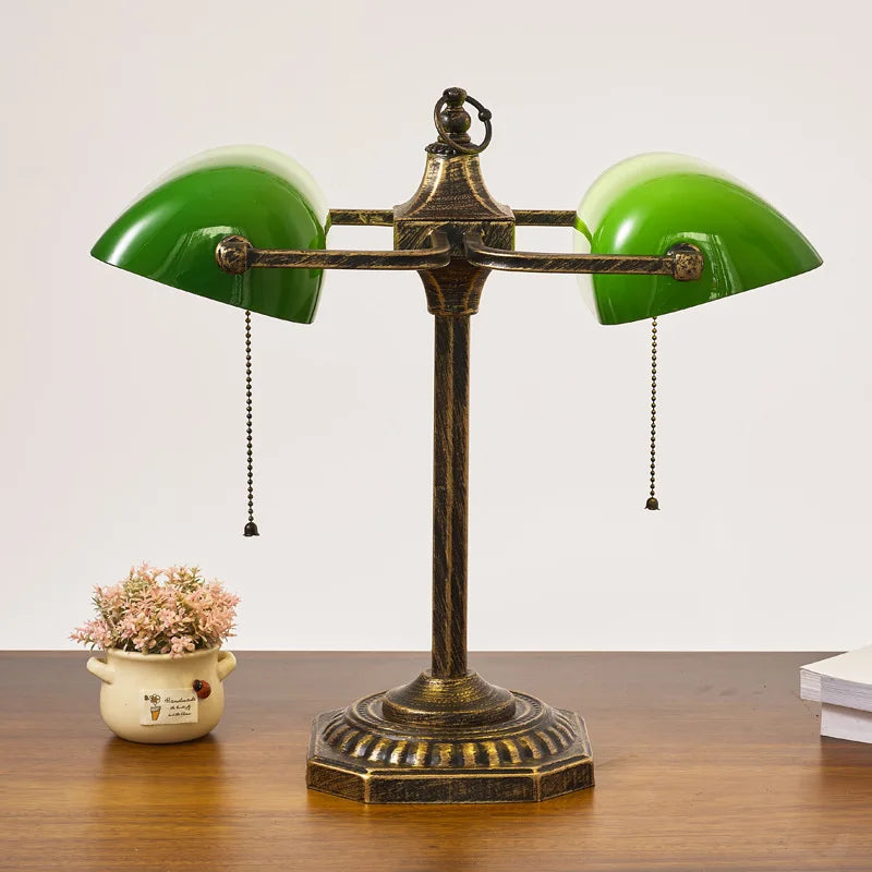 Green banker lamp shade close-up showing classic green glass dome