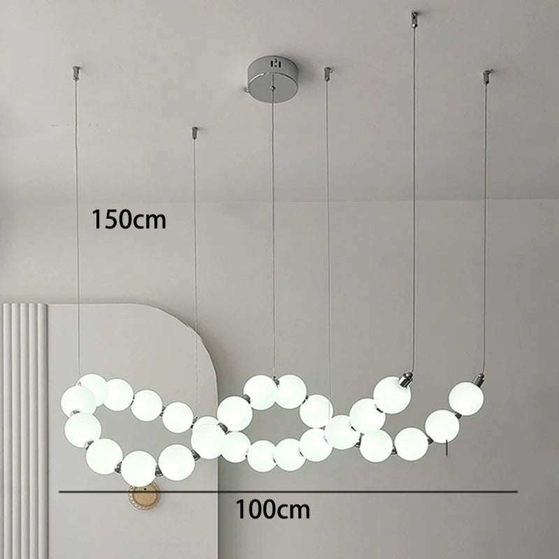 Gold strip chandelier at 49.2 in length for a kitchen counter