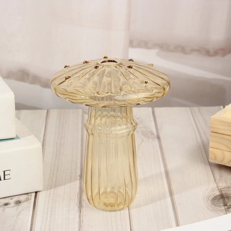 Glass mushroom vase with fresh flower styled on bohemian living room shelf