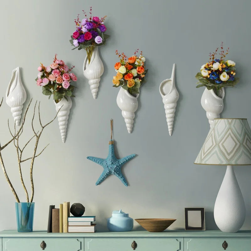 Right-mouth ceramic shell wall vase with small dried botanical arrangement