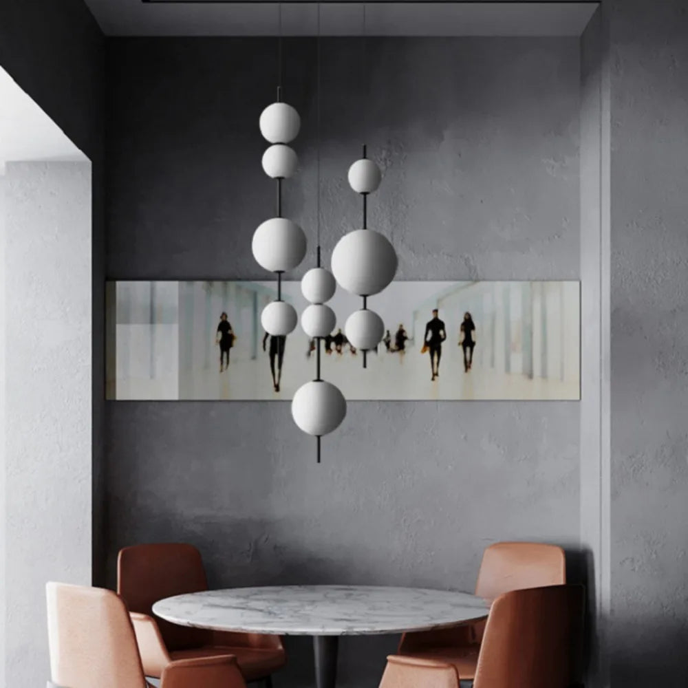 Glass sphere chandelier glowing evenly from every side of each ball