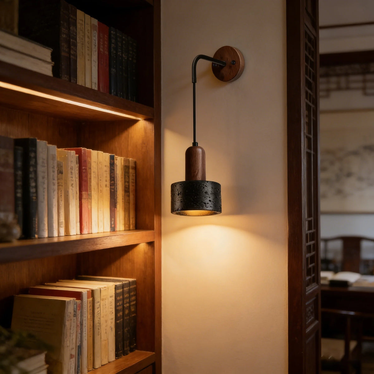 black travertine stone wall sconce, installed in a room interior setting