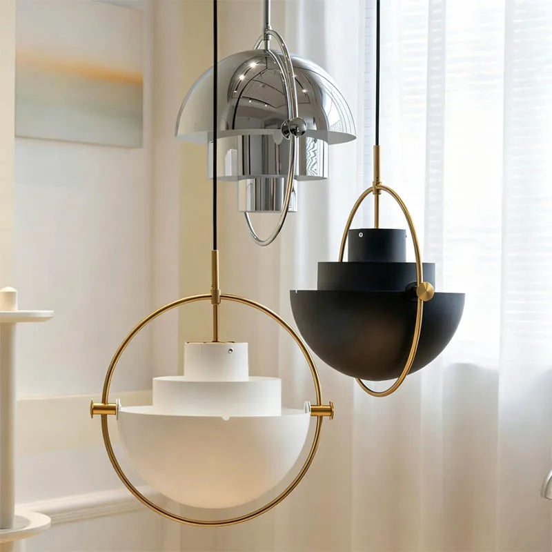 White metal chandelier shade softening light through its glass underside