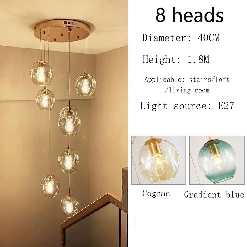 Glass globe chandelier on a polished gold chassis for a loft void