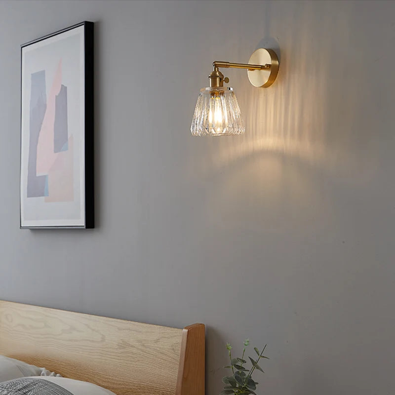 brass bathroom wall sconce, installed in a room interior setting