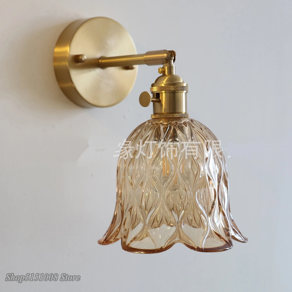 green glass wall sconce, close-up of shade and hardware detail