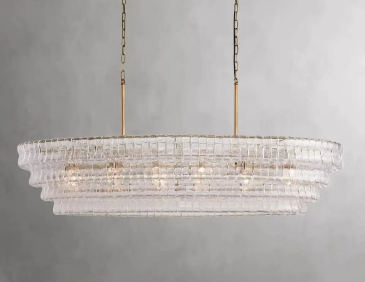 Polished stainless steel chandelier frame holding tinted glass shades