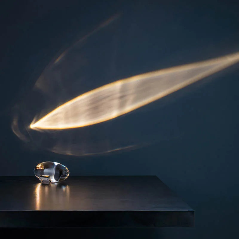 Crystal sky eye table lamp glowing blue ambient light on bedside table
