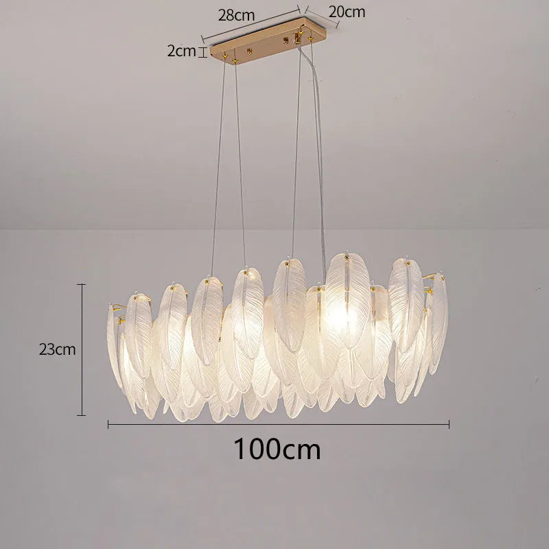 Feather glass chandelier lit in neutral 4000K light on gold metal