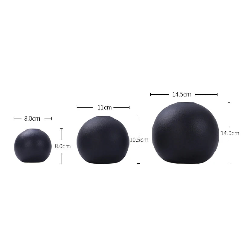 Black and white ball ceramic vases in small medium large grouped together