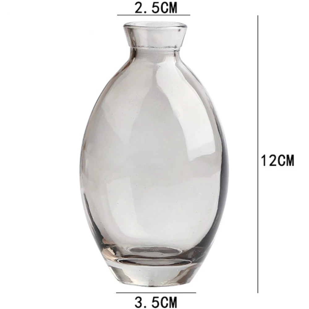 Mini glass vase as minimalist bedside table floral accent piece