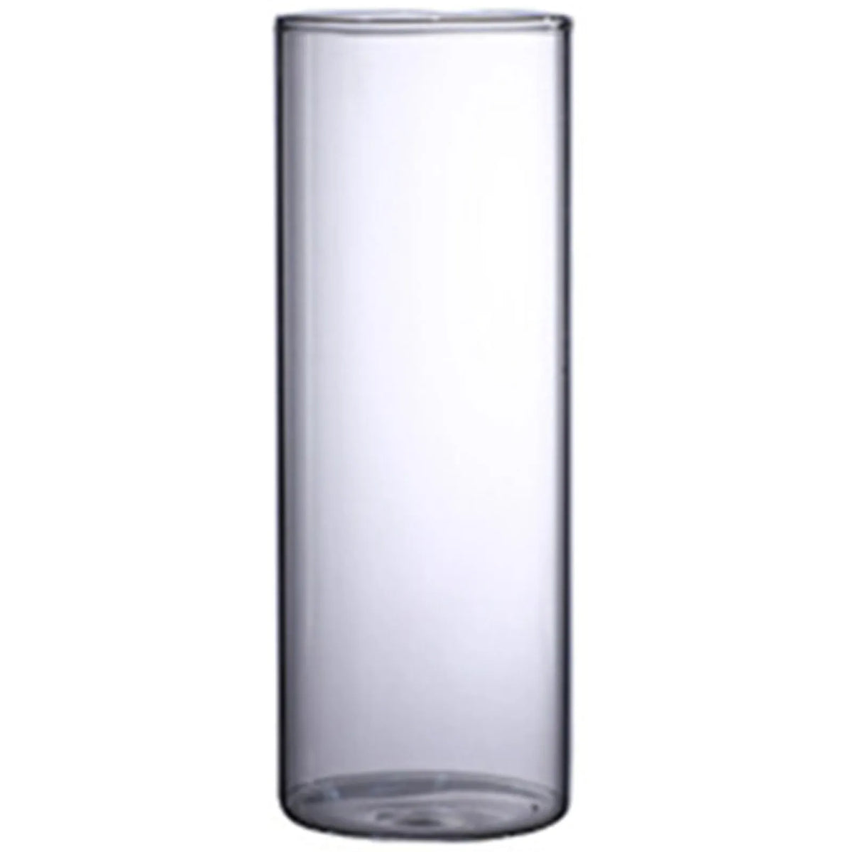 Angled view of small glass cylinder flower vase on white painted wooden side table