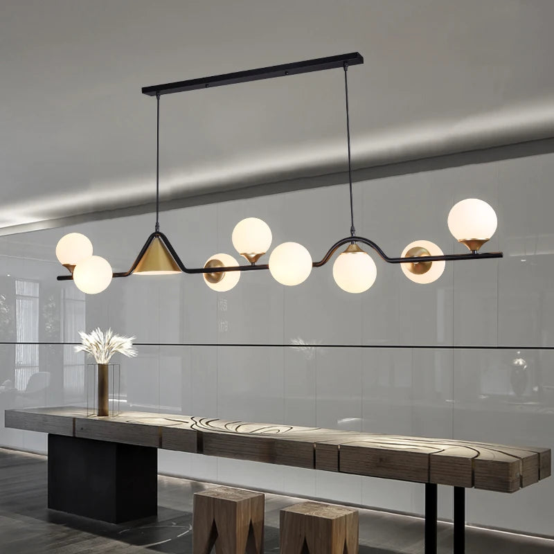 Nine head glass chandelier, 61 inches long, in smoky grey over a dining table
