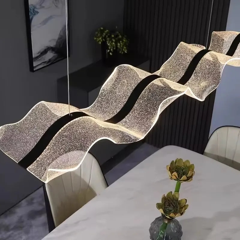 Acrylic diffuser and aluminum body detail on the wave chandelier