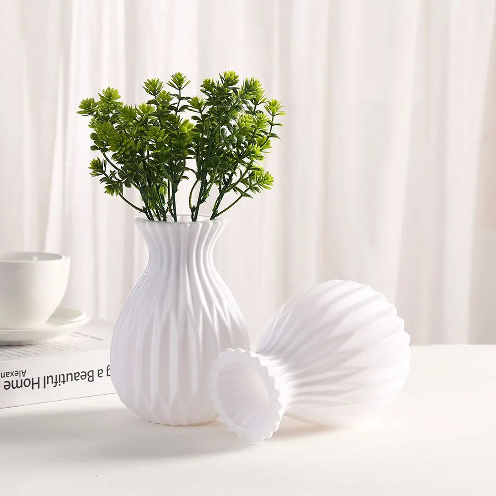 Close-up of white plastic vase surface showing smooth matte imitation ceramic finish