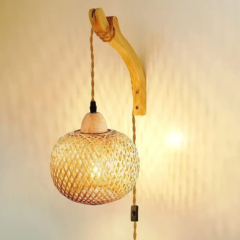 rattan wall sconce, detail view of fixture base and arm