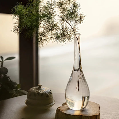 Style D Zen glass cylinder vase from above on white linen surface