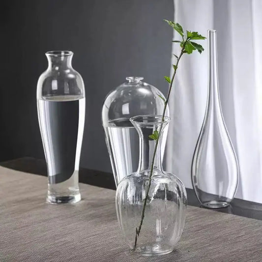 Zen glass cylinder bud vase style A with single branch on minimalist desk