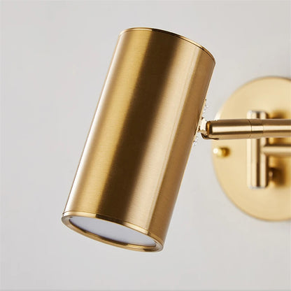 gold and black wall sconce, installed in a room interior setting