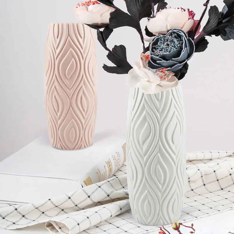 White plastic imitation ceramic vase on wooden shelf