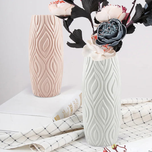 White plastic imitation ceramic vase on wooden shelf