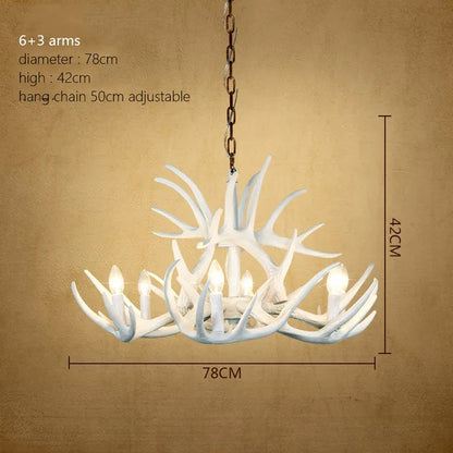 Antler arm detail with a polished wood finish and clear glass shade