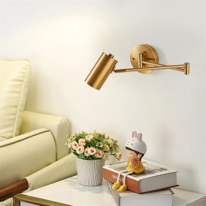 gold and black wall sconce, side profile showing mounting depth