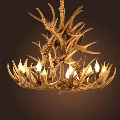 Rustic antler wood chandelier with clear glass shades on branching arms