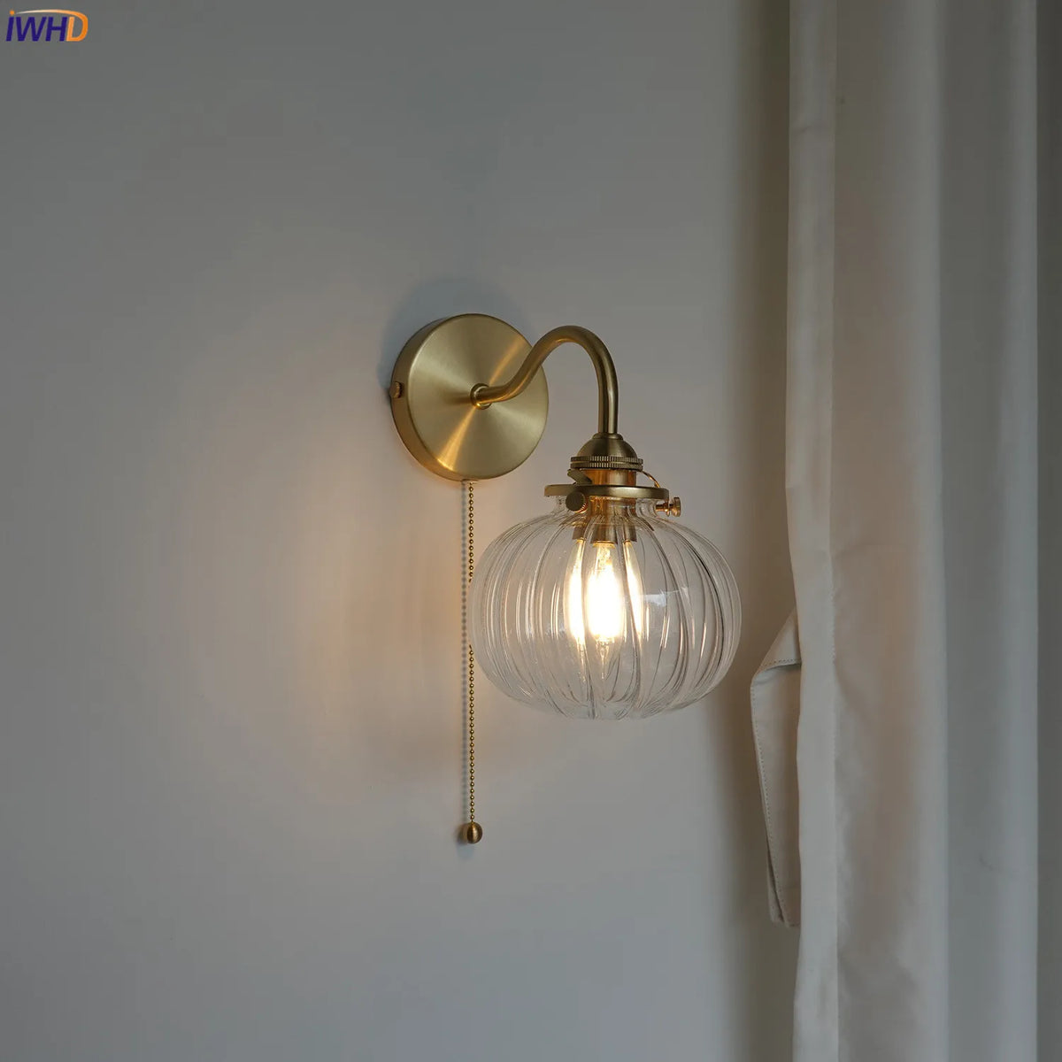 copper plug-in wall sconce, front view on white background