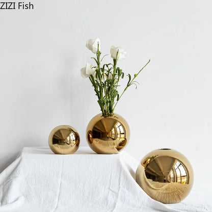 Three gold ball ceramic vases small medium large together
