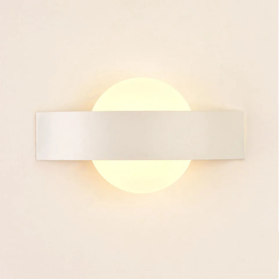 black wall sconce, installed in a room interior setting